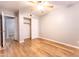 Bedroom featuring laminate flooring, gray walls, closet, and a ceiling fan at 910 W Redondo Dr, Gilbert, AZ 85233