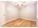 Bedroom featuring laminate flooring, a ceiling fan, and a bright window at 910 W Redondo Dr, Gilbert, AZ 85233