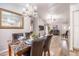 Open-concept living area featuring wood floors, modern chandelier, and views of the living area at 910 W Redondo Dr, Gilbert, AZ 85233