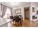 Dining area featuring wood floors, modern chandelier, and views of the living area at 910 W Redondo Dr, Gilbert, AZ 85233