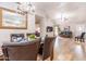 Elegant dining room featuring a chandelier and views into the living room at 910 W Redondo Dr, Gilbert, AZ 85233