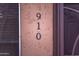 Close-up view of the house number and the exterior wall of the house, showcasing the stucco finish at 910 W Redondo Dr, Gilbert, AZ 85233