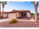 Beautiful single-story home featuring a desert landscape, palm trees, and a terra cotta-tiled roof, perfect for low-maintenance living at 910 W Redondo Dr, Gilbert, AZ 85233