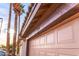 Detail of a well-maintained two-car garage with the house number 910, showing a stucco exterior and tile roof at 910 W Redondo Dr, Gilbert, AZ 85233