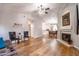 Open-concept living space with hardwood floors and views to the kitchen and dining area at 910 W Redondo Dr, Gilbert, AZ 85233