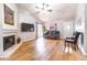 Cozy living room with a fireplace, tile floors, and comfortable seating at 910 W Redondo Dr, Gilbert, AZ 85233