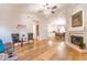 Spacious living room features a fireplace, hardwood floors, and an elegant chandelier at 910 W Redondo Dr, Gilbert, AZ 85233