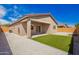 Inviting backyard featuring a covered patio and low-maintenance gravel landscaping at 947 E Wiley Way, Casa Grande, AZ 85122
