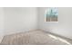 Bedroom with neutral carpet and a window with leafy green tree view at 947 E Wiley Way, Casa Grande, AZ 85122
