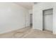 Bright bedroom features neutral carpet, and a closet with sliding doors at 947 E Wiley Way, Casa Grande, AZ 85122