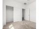 Bedroom includes neutral carpet, closet and an open doorway to another room at 947 E Wiley Way, Casa Grande, AZ 85122