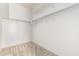 Bright walk-in closet features neutral carpet and shelving at 947 E Wiley Way, Casa Grande, AZ 85122