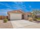 Welcoming single-Gathering home with a two-car garage and low-maintenance front yard at 947 E Wiley Way, Casa Grande, AZ 85122