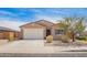 Charming home featuring desert landscaping, a two-car garage, and tasteful exterior paint at 947 E Wiley Way, Casa Grande, AZ 85122