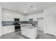 Bright kitchen features white cabinetry, gray granite countertops, stainless steel appliances and blue backsplash at 947 E Wiley Way, Casa Grande, AZ 85122