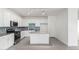 Bright kitchen features white cabinetry, gray granite countertops, stainless steel appliances and blue backsplash at 947 E Wiley Way, Casa Grande, AZ 85122