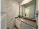 Bright bathroom with a large mirror over the single sink vanity at 9923 E Tahoe Ave, Mesa, AZ 85212