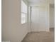Neutral bedroom featuring a window with blinds and a closet with paneled doors at 9923 E Tahoe Ave, Mesa, AZ 85212