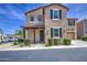 Charming two-story home showcasing a covered entryway, desert landscaping, and a clean stucco exterior at 9923 E Tahoe Ave, Mesa, AZ 85212