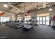 Well-equipped fitness center with treadmills, weights, and large windows for natural light and a view at 9923 E Tahoe Ave, Mesa, AZ 85212