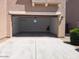 Spacious two-car garage with an open door and concrete flooring for easy parking and storage at 9923 E Tahoe Ave, Mesa, AZ 85212