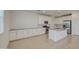 Eat-in kitchen featuring white cabinets, stainless appliances, and gray countertops at 9923 E Tahoe Ave, Mesa, AZ 85212
