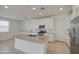 Beautiful kitchen featuring gray countertops, stainless appliances, and a center island at 9923 E Tahoe Ave, Mesa, AZ 85212