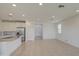 Open-concept living area with recessed lighting and tile flooring leading to the kitchen at 9923 E Tahoe Ave, Mesa, AZ 85212