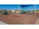 Colorful playground featuring slides, climbing structures and shaded seating, perfect for Gathering fun and recreation at 9923 E Tahoe Ave, Mesa, AZ 85212