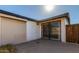 Exterior of home with a rolling door, access door with security gate, and brick wall at 1038 E Northern Ave, Phoenix, AZ 85020