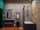 A contemporary bathroom includes a modern vanity, enclosed tub, and chic fixtures for a luxurious experience at 1038 E Northern Ave, Phoenix, AZ 85020