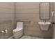 An accessible bathroom with tiled walls, a modern sink, and grab bars for convenience at 1038 E Northern Ave, Phoenix, AZ 85020
