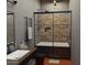 This modern bathroom features a soaking tub, sleek fixtures, and stylish tile work, creating a spa-like retreat at 1038 E Northern Ave, Phoenix, AZ 85020
