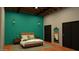 Bedroom with wood bedframe, teal accent wall, and two black closet doors at 1038 E Northern Ave, Phoenix, AZ 85020