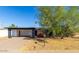 Charming single-story home with an open carport and mature landscaping, offering shade and curb appeal at 1038 E Northern Ave, Phoenix, AZ 85020
