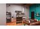 A cozy living area features a compact kitchen with stainless steel appliances, perfect for modern living at 1038 E Northern Ave, Phoenix, AZ 85020