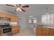 Open concept kitchen features stainless steel oven, wood cabinets, and view to dining area at 1038 E Northern Ave, Phoenix, AZ 85020