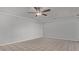 Living room featuring tile flooring, a ceiling fan, and neutral-toned walls at 1038 E Northern Ave, Phoenix, AZ 85020
