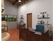 Bright office space with a large desk, custom shelves, and rustic lighting fixtures at 1038 E Northern Ave, Phoenix, AZ 85020