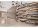 Spacious, open concept interior featuring tile flooring and a modern wood accent wall at 11321 W Austin Thomas Dr, Surprise, AZ 85378