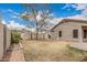 Spacious fenced backyard with mature tree, ideal for outdoor living at 11321 W Austin Thomas Dr, Surprise, AZ 85378