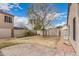 Large backyard featuring mature landscaping and secure fencing at 11321 W Austin Thomas Dr, Surprise, AZ 85378