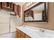 Bathroom featuring a double sink vanity, framed mirror, and shower with sliding glass doors at 11321 W Austin Thomas Dr, Surprise, AZ 85378