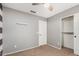 Bedroom featuring a ceiling fan, closet and neutral color carpet at 11321 W Austin Thomas Dr, Surprise, AZ 85378