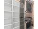 Convenient laundry room with washer, dryer, and ample storage shelves at 11321 W Austin Thomas Dr, Surprise, AZ 85378