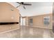 Open floor plan features tile flooring, neutral walls, and a built-in media center at 11321 W Austin Thomas Dr, Surprise, AZ 85378