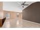 Bright and airy living room featuring neutral colors, tile flooring, and ample natural light from windows at 11321 W Austin Thomas Dr, Surprise, AZ 85378