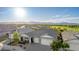 Scenic aerial view of the home showcasing its well-manicured landscaping and panoramic mountain views in a desirable community at 11656 N San Clemente St, Surprise, AZ 85388