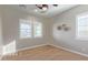 Bright and airy bedroom with shuttered windows and neutral décor, perfect for relaxation at 11656 N San Clemente St, Surprise, AZ 85388