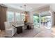 Elegant dining room boasts a modern light fixture, outdoor access, and a view of the patio at 11656 N San Clemente St, Surprise, AZ 85388